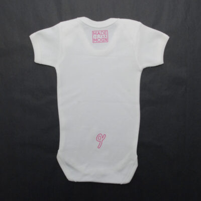 Pig Tail on back of baby grow